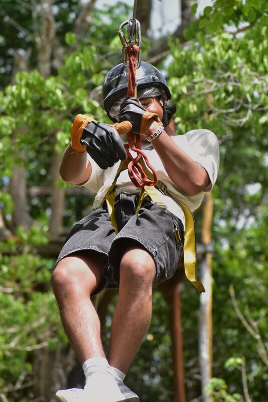 A person riding a zip line